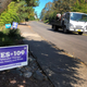 A truck drives past a sign supporting a ballot measure in Oregon to legalize the controlled, therapeutic use of psilocybin mushrooms.
